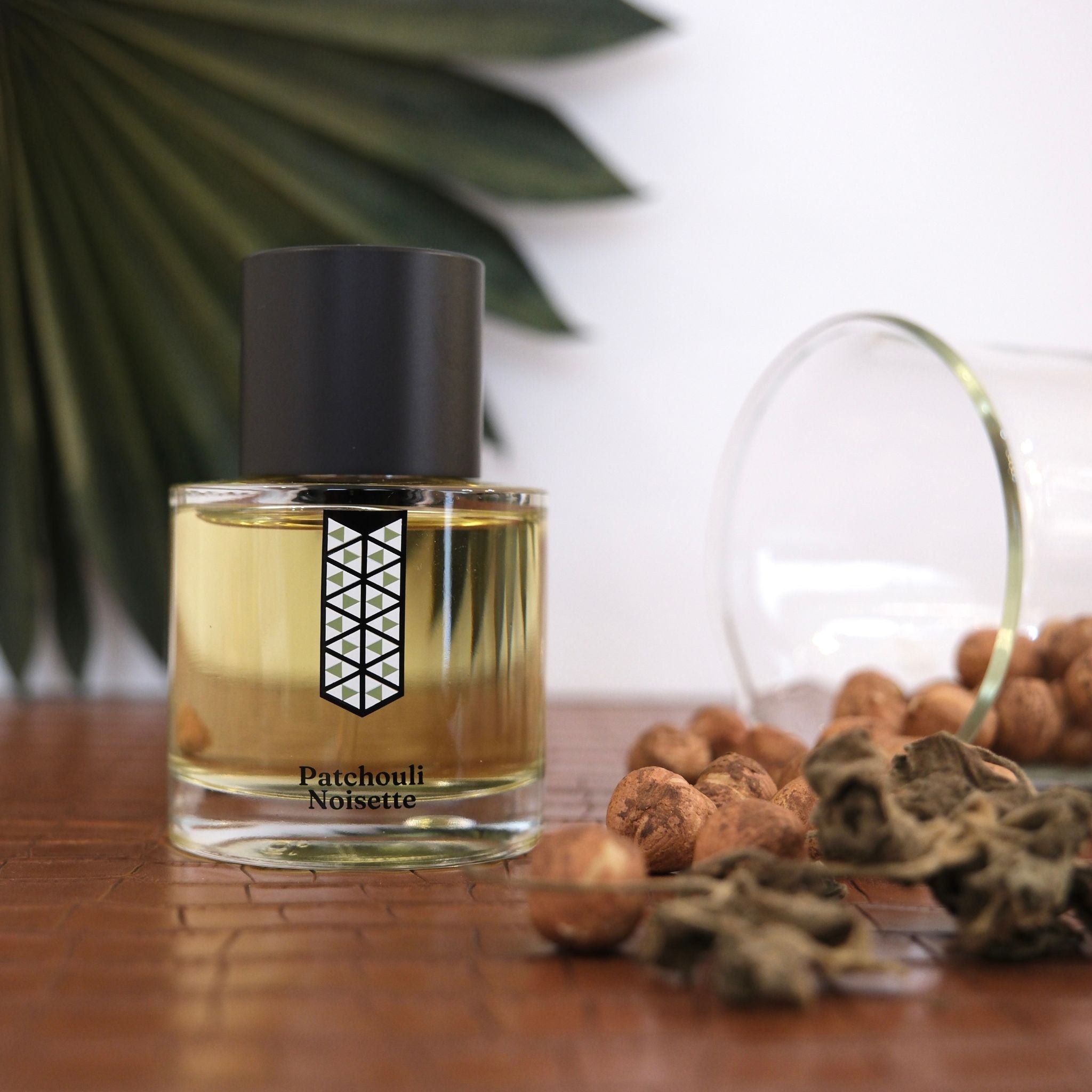 The 'Hazelnut Patchouli' perfume bottle from Les Indemodables, capturing the essence of luxury and innovation.