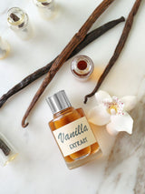 Curated collection of vanilla-based perfumes, showcasing elegant bottles of Bianco Latte, Escapade Gourmand, Accident a la Vanille, and Vanille Antique, highlighting their rich and indulgent vanilla scents
